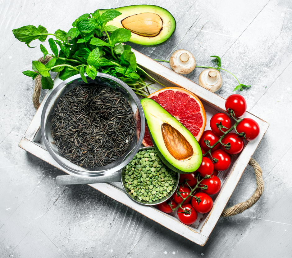 No Bloat meal pouches with fresh ingredients on a wooden surface